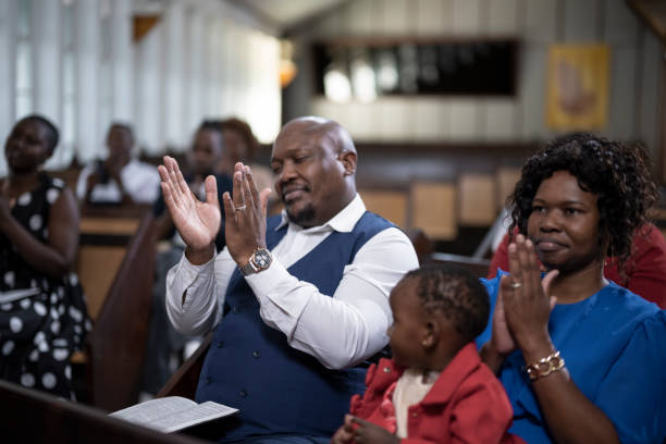 istock Congregation clapping and praying in church 1489173275