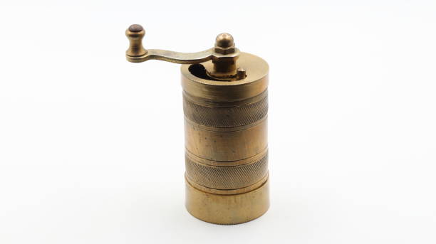 istock a hand-turned coffee grinder on a white background. close-up. 1489173458