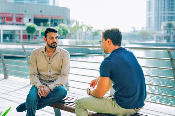 istock Two friends talking outdoors 1489177217