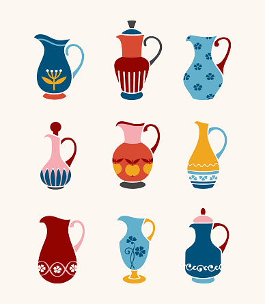 Different colorful painted jugs. Set of ceramic crockery.