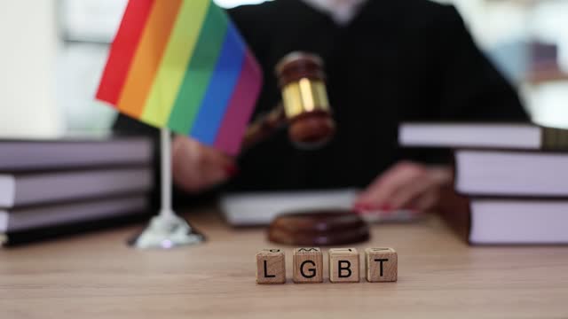 LGBT rights and law and wooden blocks with text LGBTQ on background of judge gavel