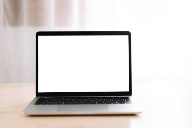 istock Laptop with white blank screen on wooden table 1489189356