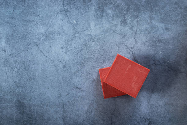 istock handmade natural soap bars on cement background. 1489190777
