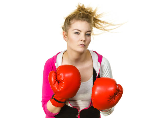 istock Woman wearing boxing gloves 1489192429