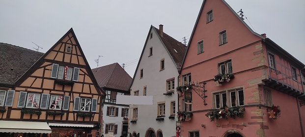 Image of some houses decorated for Christmas in the village of Eguisheim