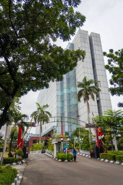 a public sector worker making their way in front of the Ministry of Social Affairs building in Cawang an official from the Indonesian civil service walking in front of the Ministry of Social Affairs office complex in Jakarta's east district public service employee stock pictures, royalty-free photos & images