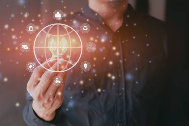 istock Businessman holding light bulb with globe icons. environmental conservation and modernization of technology 1489194718
