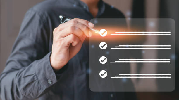 istock Business performance checklist, businessman using laptop doing online checklist survey, filling digital form checklist, taking 1489194721