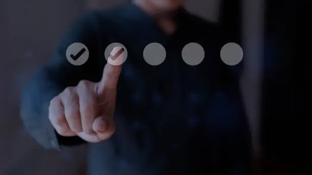 Photo of Businessman touching tick icon on virtual screen. Checklist concept