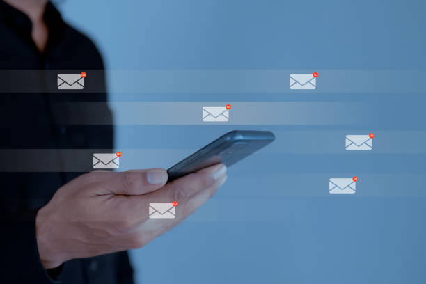 istock Businessman using smartphone with email icon, email inbox electronic communication graphic concept. 1489195033