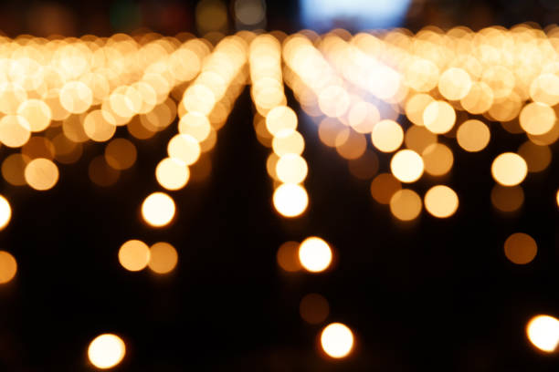 istock Abstract golden bokeh from candle light on black background. 1489195956
