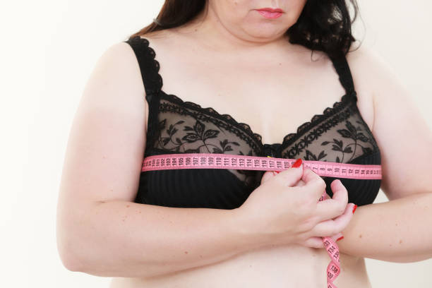 istock Woman measuring her chest breasts bust size 1489196964