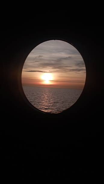 istock Sunset photographed from the porthole 1489198129