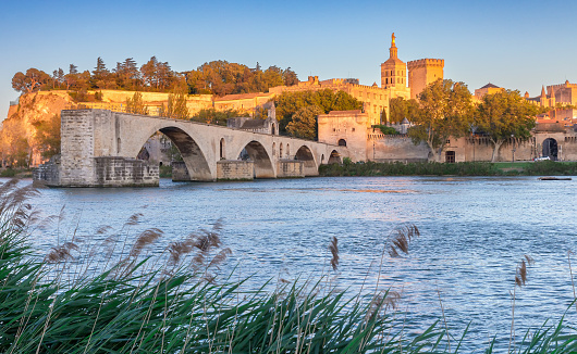 The famous medieval bridge of St. Benezet across the river Rhone at sunset. Avignon. France. Provence.