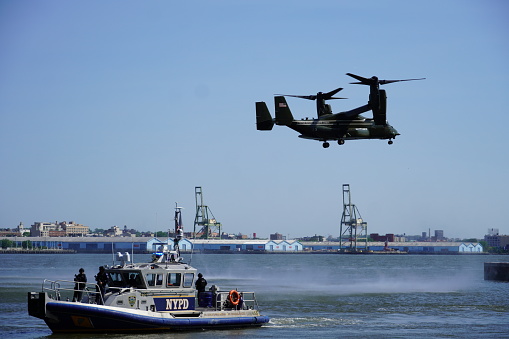 Plane landed on beach. Action. Aircraft is located on seashore. Plane is standing on beach on background of sea. Ekranoplan.