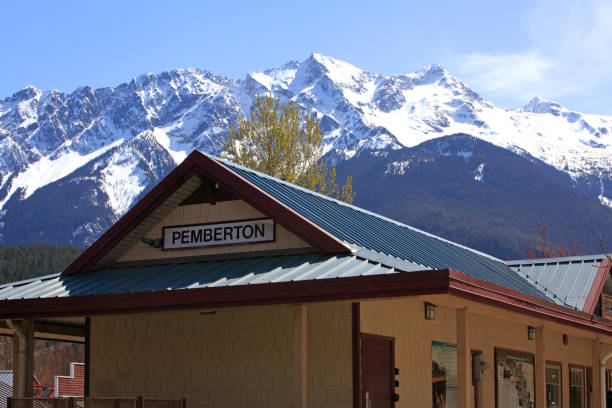 Pemberton BC Historic Train Station And Mt Currie Travel destination in BC. Train Station with Mt Currie in Background.  Metal roof on building. pemberton town stock pictures, royalty-free photos & images