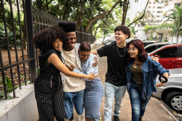istock Friends talking while walking in the street 1489202845