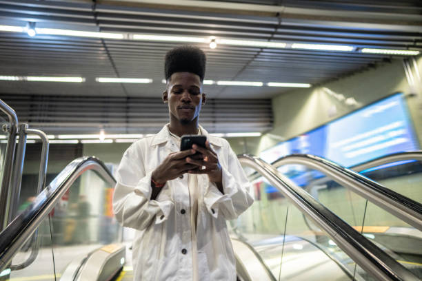 istock Young man using the mobile phone at the subway station 1489202951