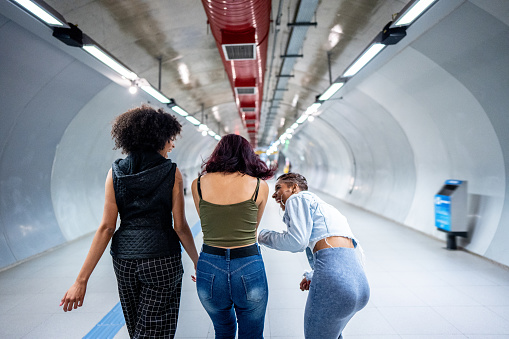 Friends walking at the subway station