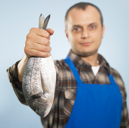 Male fish vendor.