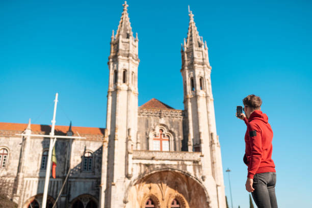 istock Tourist taking photo with cell phone at Jeronimos Monastery 1489206818