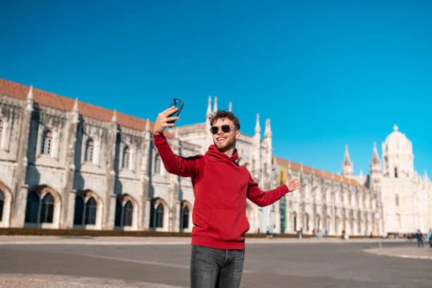 istock Influencer recording a vlog showing the Jeronimos Monastery 1489206873