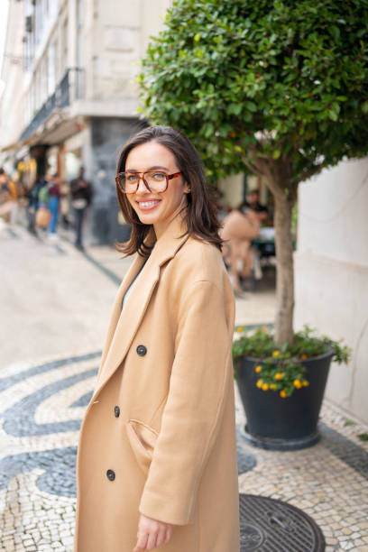 istock Friendly smiling attractive woman leaving building 1489207147