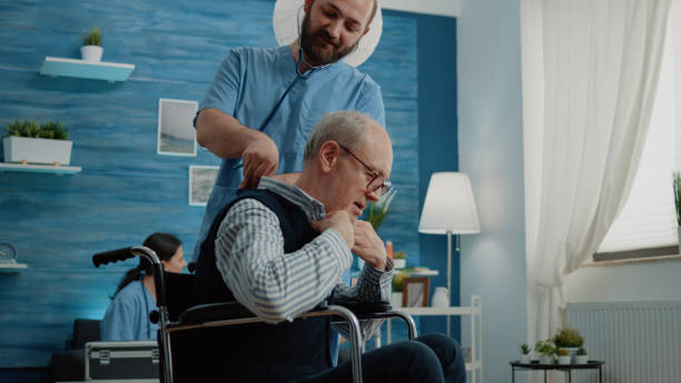 istock Disabled patient receiving consultation from man nurse 1489211221
