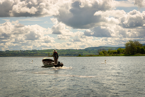 retired man fishing on the lake,having hobbies is healthy fishing is very beneficial for older people, as it provides them with a sense of purpose and personal satisfaction. In addition, fishing is a relaxing activity and can help reduce stress and anxiety levels.