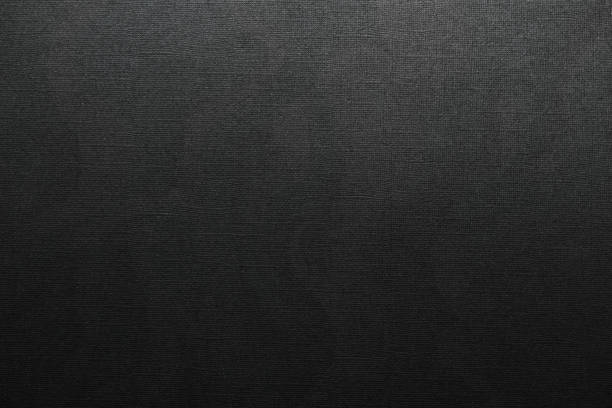 istock digital macro photo of black paper with dark printer ink on it and cool structure. 1489218355