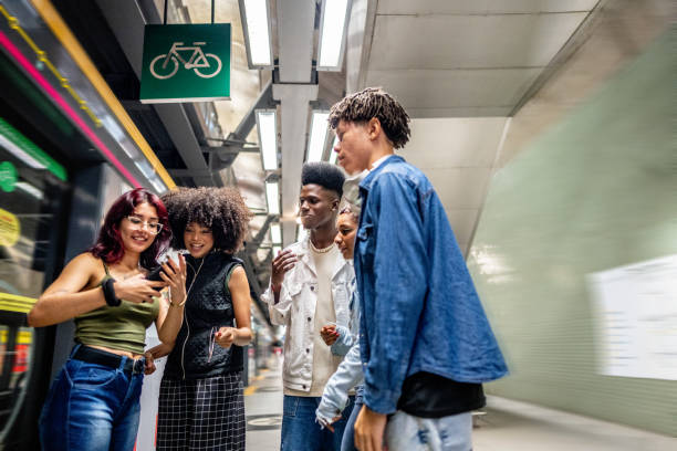 istock Friends using the mobile phone at the subway station 1489218428