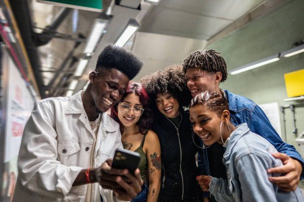 istock Friends using the mobile phone at the subway station 1489218551