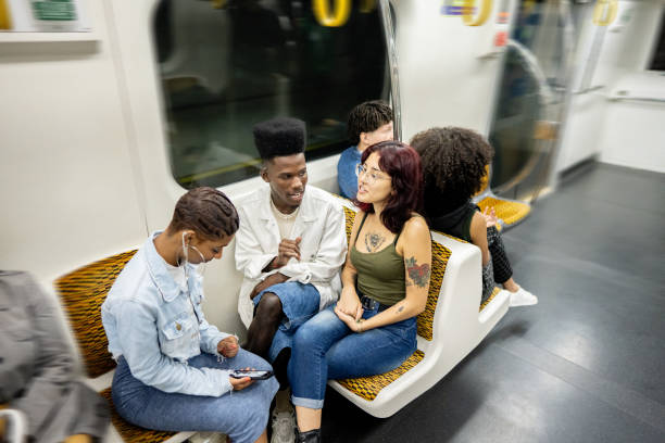 istock Friends talking on the subway train 1489218931