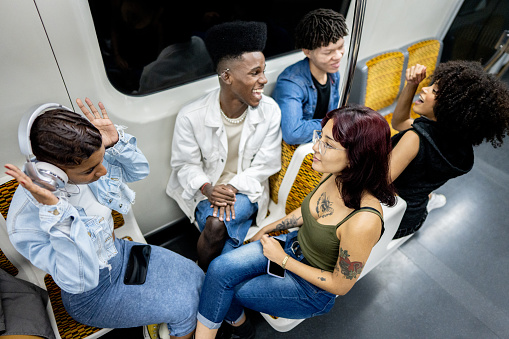 Friends talking on the subway train