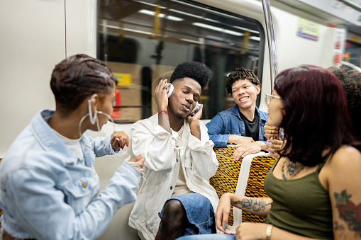 Friends talking on the subway train