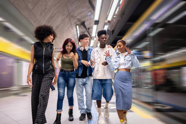 istock Friends talking while walking at the subway station 1489220001