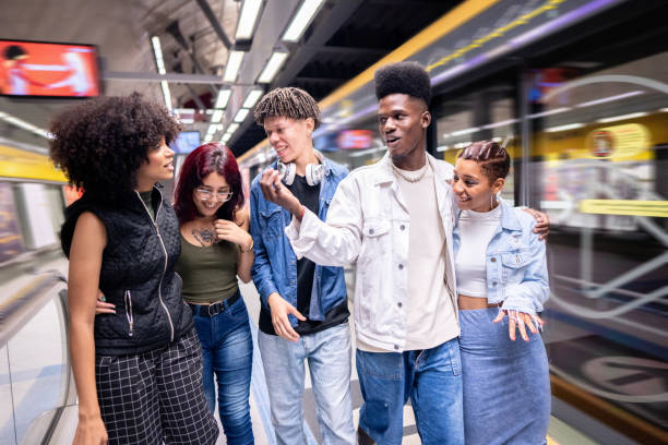 istock Friends talking while walking at the subway station 1489220002