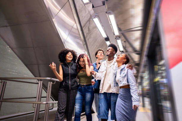 istock Friends talking while walking at the subway station 1489220107
