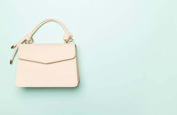 istock Fashionable leather bag on color background, top view 1489220720