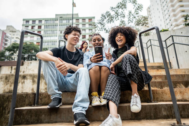istock Friends using the mobile phone outdoors 1489220822