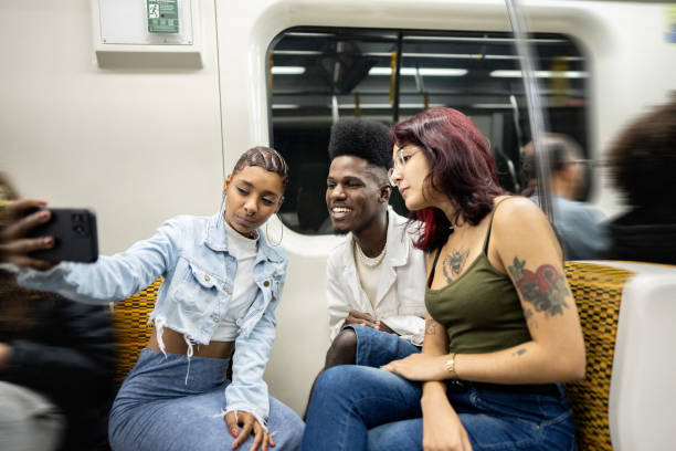 istock Friends taking selfies on the mobile phone on the subway train 1489221789