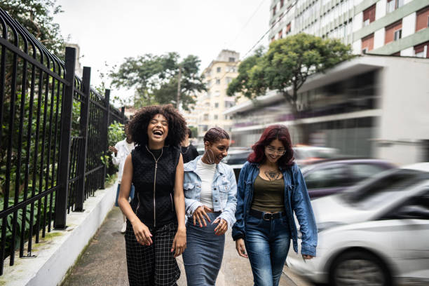 istock Friends talking while walking in the street 1489222181