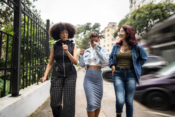 istock Friends talking while walking in the street 1489222212