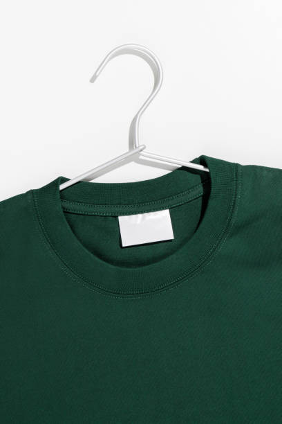 istock Green t-shirt on a clothes rack. Ecology concept. Mockup. 1489222443