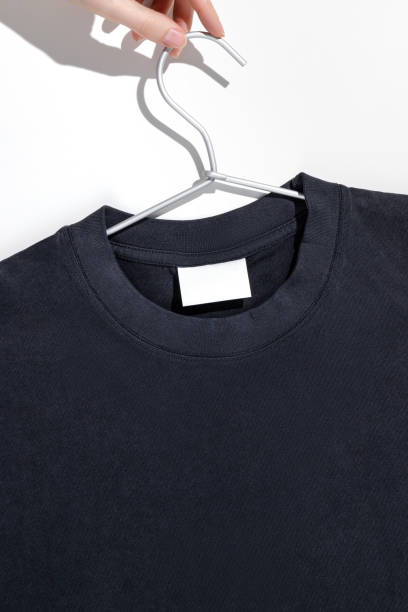 istock Black t-shirt with blank label on a clothes rack. Ecology concept. Mockup. 1489222525
