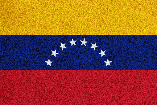 Flag of the Venezuela on a textured background. Concept collage.