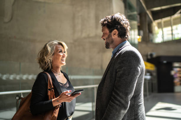 istock Coworkers talking at a subway station 1489233478