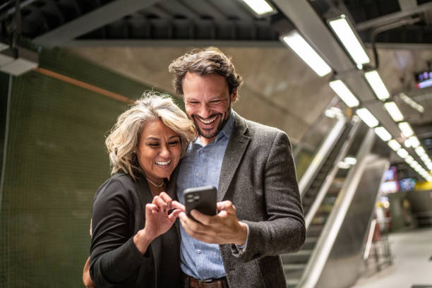 istock Friends using the mobile phone at a subway station 1489235146