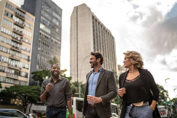 istock Coworkers talking while walking in the street 1489236718