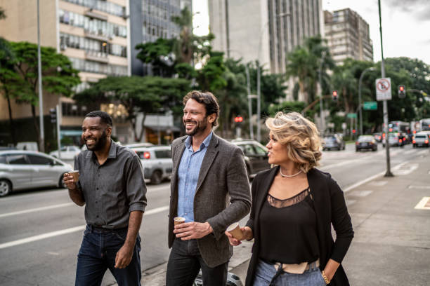 istock Coworkers talking while walking in the street 1489236722